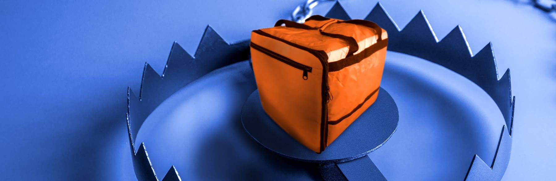 A delivery bag as bait on the inside of a bear trap.
